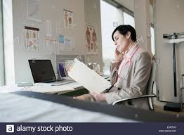 doctor reading chart stock photos doctor reading chart