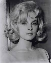 Does anyone know how I can achieve this 60's hair that Marilyn had in her  last year's? I cannot find any tutorial out there I have looked but the  ones I found
