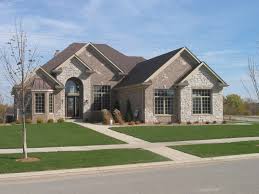 A cottage's charming simplicity of design helps showcase any type of stone or brick cladding. Brick And Rock House Designs