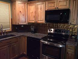 Natural Stain Knotty Alder Kitchen Cabinets Gold Tile Backsplash Dark Granite Counter Top Kit Alder Kitchen Cabinets Alder Cabinets Cheap Kitchen Cabinets