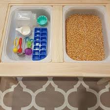 Pouring And Transferring Earlier This Week We Changed The Contents Of Our Ikea Flisat Table We Had Black Bea Toddler Sensory Bins Sensory Boxes Sensory Table