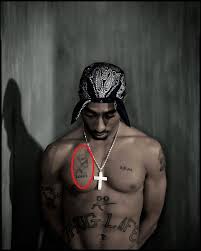 If you continue to use this site we will assume that you are happy with it.ok read more. Tupac Shakur S 21 Tattoos Their Meanings Body Art Guru