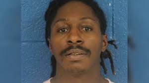 Convicted felon found sitting in car