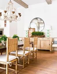 Rush Back Dining Chairs With White Tie Back Cushions Aligned At A Dark Brown Wood Dining Table Dining Room Buffet Wood Dining Room Sideboard Decor Dining Room