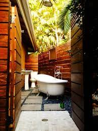 Outdoor elements maximized the available space in this beautiful yard with a contemporary, rectangular pool complete with a large tanning deck and swim jet system. Small Outdoor Bathroom Novocom Top