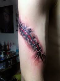 Tattoos aren't more likely to cause keloids than other skin traumas. Skin Rip Repair Tattoo Deff Want A Rip Skin Tattoo Someday 3 Ripped Skin Tattoo 3d Tattoos Tattoos For Guys
