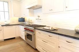 Topics include colors, pros and cons, mineral comparison, cost, cleaning and maintenance. White And Black Kitchen With White Exposed Brick Backsplash Transitional Kitchen