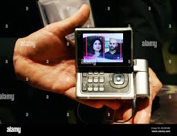 A visitor holds the new Nokia N92, a ...