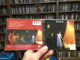 With geddy lee, alex lifeson, neil peart. Rush Exit Stage Left Cd Photo Metal Kingdom