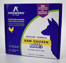 It features a light blue bag with a white circle with a blue outer edge and the word 'food!' on the front. Answers Pet Food Detailed Nibbles Chicken 1oz 856554002188