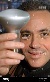 Raymond Angelo, President of Angelo Brothers Co., holds up one of his  products in Philadelphia, Wednesday, Jan. 22, 2003. Angelo Brothers Co., a  long-time Philadelphia lighting distributor, changed its name and the