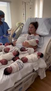 Hospital Worker Tending To Newborns