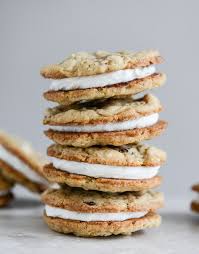 Black And White Vanilla Sandwich Cookies Chewy Black White Chip Oatmeal Sandwich Cookies With Marshmallow Buttercream Filling Recipe With Images How Sweet Eats Oatmeal Cookie Recipes Cookie Recipes