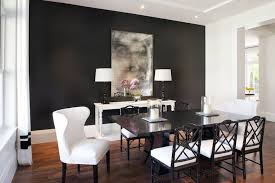 Table Lined With Black Bamboo Dining Chairs Against A Dramatic Accent Wall Paint Colour Grey Dining Room Black And White Dining Room Black Dining Room