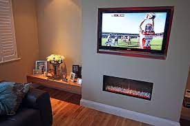 A false wall is an interior designer's dream, the current trend is a media wall to act as the focal point for your room. Fireplace With Built In Tv Accent Wall Question For Those With Tv Screens Built Flush Into A Fireplace Tv Wall Feature Wall Living Room Hanging Tv On Wall