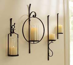 The aged tin, glass and mirrors combined with the flickering light of a candle make a dramatic impression on any room. Artisanal Wall Mount Candle Holder Pottery Barn