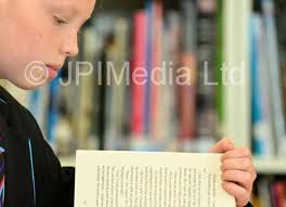 39429888-Dyke House Academy pupil Eve Stuart, reading in the library.  Reading was one of the points praised in the recent Ofsted report graded  the Academy as Outstanding Picture by FRANK REID -
