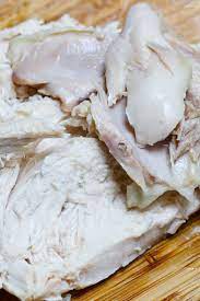 Tender And Juicy Boiled Chicken Carved Into Slices For Serving In 2021 Boiled Chicken Boiled Chicken Recipes Boil Frozen Chicken