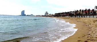 Everybody and their cousin goes to take a quick summer dip. Barceloneta Beach