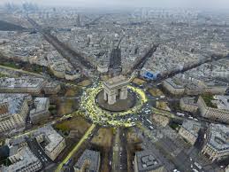 Construct a replica of the arch de triomphe, where 12 avenues meet in a roundabout. Greenpeace Cop21 Arc De Triomphe Sun Action In Paris