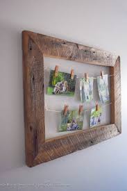 The barnwood frame has barbed wire running across the top of the frame. Diy Rustic Photo Display Making Joy And Pretty Things