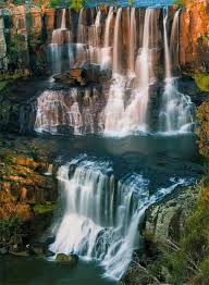 Beautiful waterfall at the mountain with blue sky and white cumulus clouds. Dado On Twitter Waterfall Places To Travel Nature Waterfall