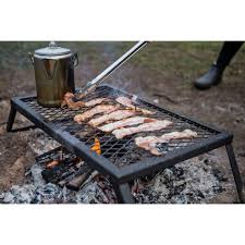 The fire, whether derived from burning charcoal or gas is what does the cooking. Coleman Over Fire Grill Outdoor Adventure South West Rocks