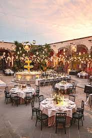 A Candle Filled Wedding Inspired By The Historic Mexican Setting Courtyard Wedding Mexico Wedding Venue Mexican Themed Weddings