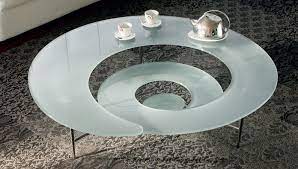The spiral coffee table flows like water and adapts to its environment through its transparent appearance. Cattelan Italia Coffee Table Spiral Coffee Table