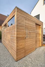 Design Garden House With Larch Wood Glass Cutouts And Sliding Door In The Shape Of A Cube Design Garden Moder In 2020 Modern Garden Design Larch Wood Garden Design