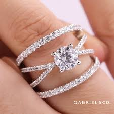 X Marks The Spot The Titania Engagement Ring Features Dazzling Diamond Bands Intersecting At The Cen Crossover Engagement Ring Wedding Ring Sets Fashion Rings