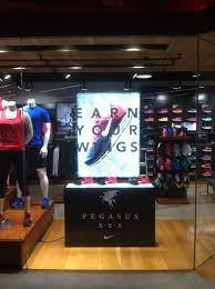 nike factory store pegasus light box retail window display sports shoe display with window decal shop window design retail windows display