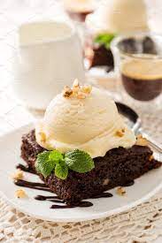 Chocolate Brownie With Vanilla Ice Cream Nuts And Mint Stock Photo Containing Ice Cream Desserts Yummy Ice Cream Christmas Ice Cream Desserts