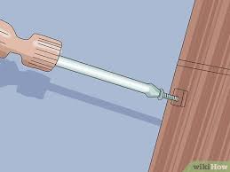 Slowly turn the nut clockwise to adjust the sensor so it's parallel with the floor and completely level with the other sensor. How To Align Garage Door Sensors 9 Steps With Pictures