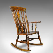 A rocking chair or rocker is a type of chair with two curved bands (also known as rockers) attached to the bottom of the legs, connecting the legs on each side to each other. Antique Rocking Chair Edwardian Country Kitchen Antique Rocking Chairs Chair Country Rocking Chair