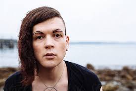 Portrait Of Gender Fluid, Transgender Person On Beach" by Stocksy  Contributor "J Danielle Wehunt"