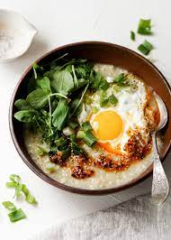 Savory Oatmeal With A Fried Egg And Chili Oil Eat Cho Food Asian Breakfast Savory Oatmeal Healthy Egg Breakfast
