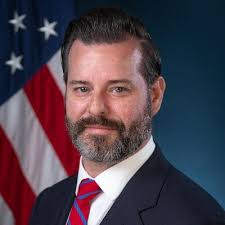 AUSA Jason Reding Quiñones presents Patriot Awards from DOD's ESGR to his  supervisors, Deputy Chief Anthony Erickson-Pogorzelski and Division Chief  Dexter Lee, for their unwavering support of his continued reserve service.  Jason