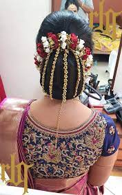 What A Beautiful Low Bun With Real Flower Gajra Care However Should Be Taken Before A Indian Wedding Hairstyles Beautiful Wedding Hair Bridal Hair Decorations