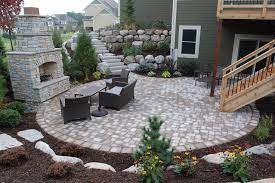 Retaining Wall Stairs Leading To Patio Below By Walkout And Deck Stairs Heins Nursery Backyard Backyard Patio Backyard Patio Designs