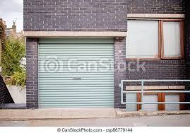 We are going to look at the cost of building of a 24 x 24 feet garage, which can be converted to 7.315 x 7.315 metres in metric units of measurements used in south africa. Landscape View Of The Garage Door Of A Dark Colour Brick Building With Trees In The Background And From London Uk Canstock