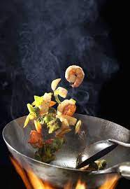 How To Use A Wok For Stir Frying Steaming Foodal Amazing Food Photography Food Photography Toss Food