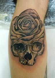 Here are a skull and rose tattoo which happens to be shrouded in some kind of mist. 30 Black Rose Tattoo Designs Images And Picture Ideas