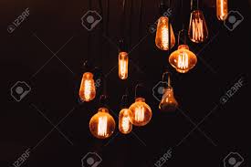Hanging Dim Vintage Style Tungsten Light Bulb On Dark Background Stock Photo Picture And Royalty Free Image Image 86180025