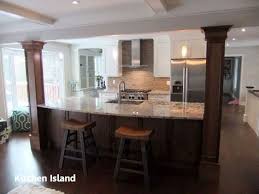 Notice how the floor remains consistent, but the column, in combination with the similarly sized beams, marks the kitchen space. Diy Guide For Making A Kitchen Island 3 Kitchen Island Ideas With Columns Kitchen Columns Kitchen Island With Seating
