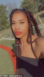 Black Kansas cheerleader says she was kicked off of her college team over  her long braids