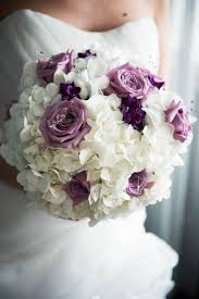 Due to the ongoing pandemic, flower supply lines are not running at full capacity. Purple And White Hydrangea And Rose Bouquet