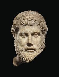 AN ETRUSCAN BRONZE VESSEL HANDLE , CIRCA 475-450 B.C.