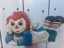 On ebay, crafters can find vintage hand embroidery kits from the 1970s or mixed lots for various periods. Vintage Raggedy Ann Wall Decor 1977 So Cute