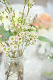 When it arrived it was even more beautiful with no issues to report. Dayton Wedding By Andrea Dozier Pretty Flowers Arrangements Flowers In Jars White Wax Flower